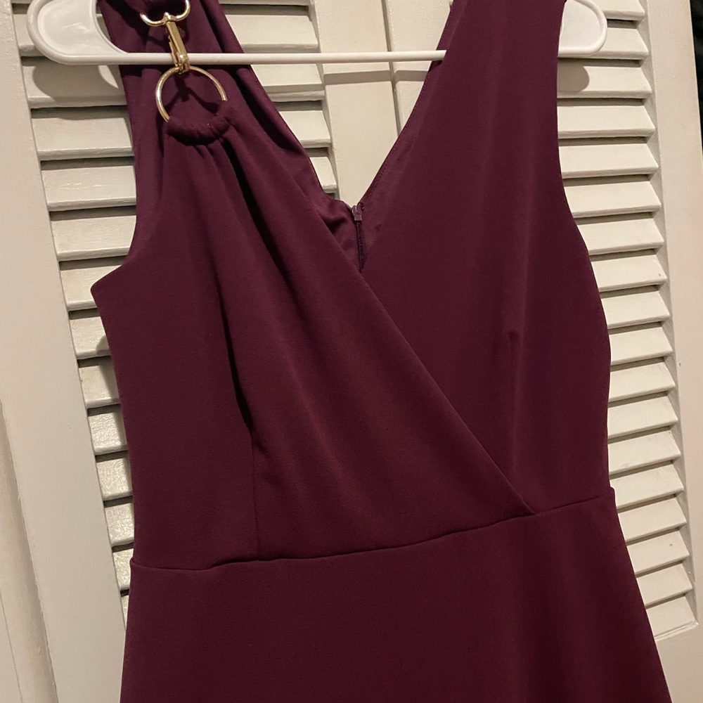 A burgandy fit and flare, stretchy dress